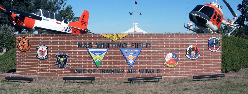 Testimonials 1 a brick sign that has a bunch of patches on it