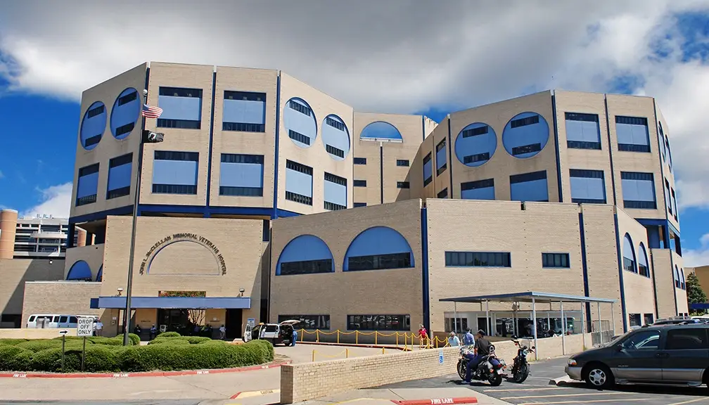 a large building with a car parked in front of it