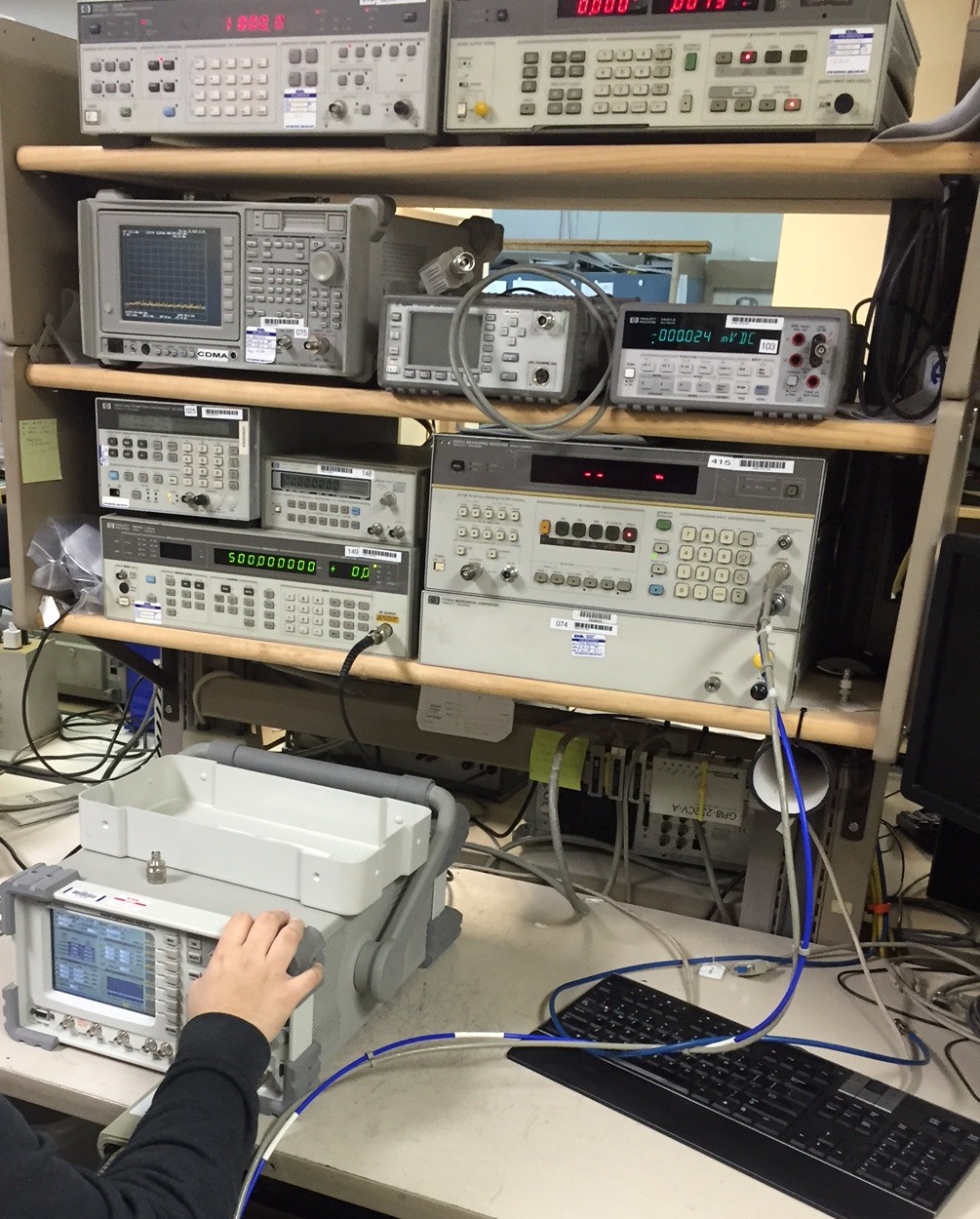 a man is looking at some electronic equipment