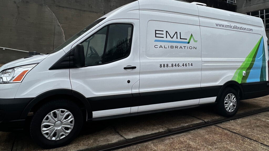 a white van parked in front of a building